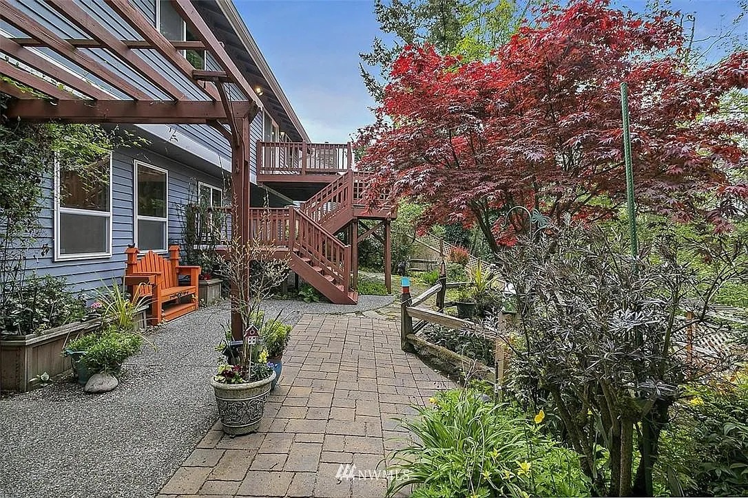 Garden path and outdoor seating beside the 6th Avenue residence